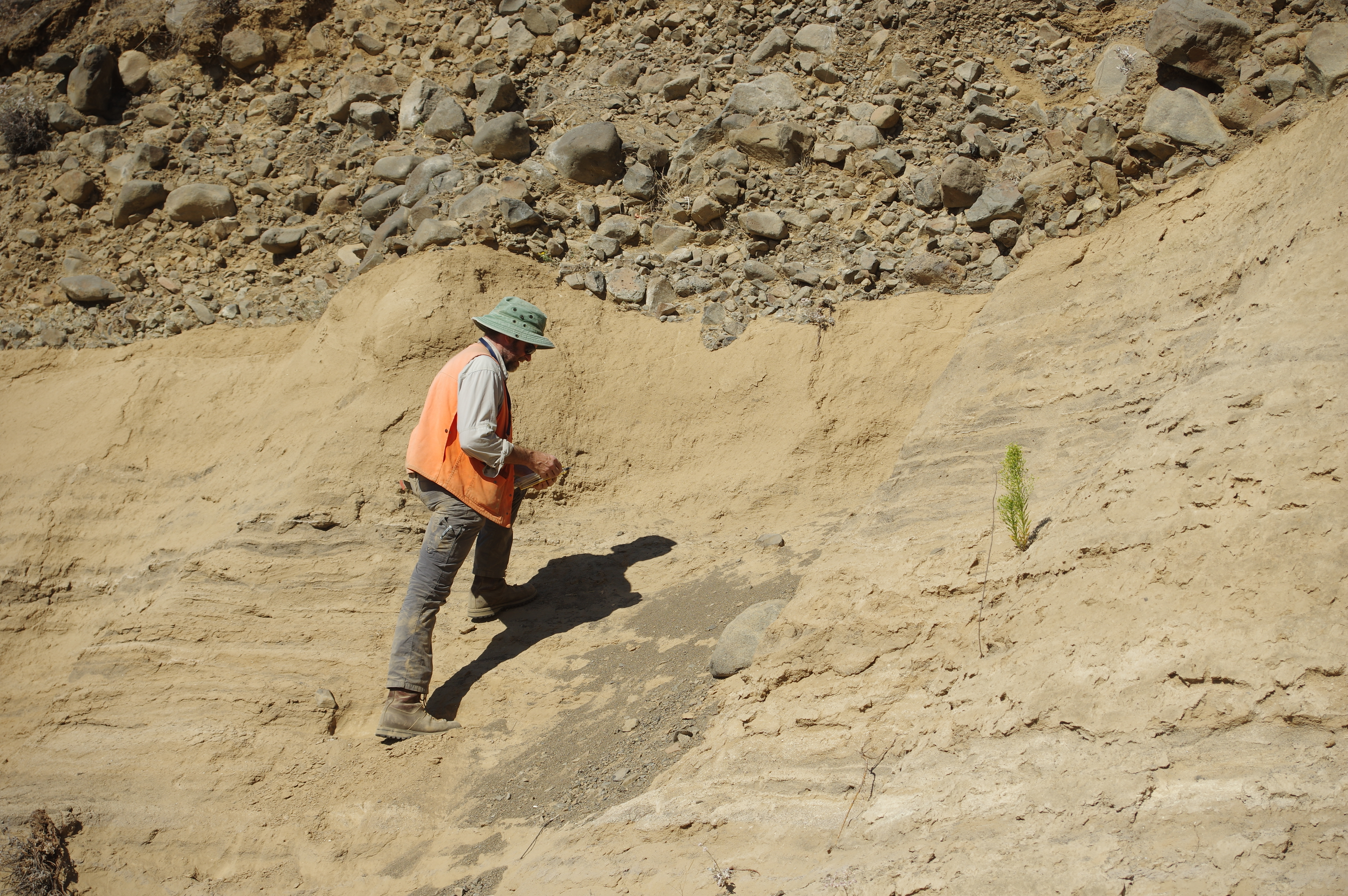 USGS scientist, Jim O'Connor describing an outcrop